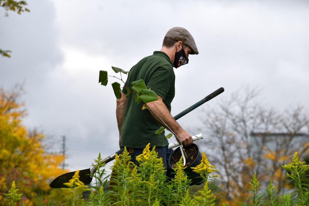 Crafting Captivating Headlines: Your awesome post title goes here a-man-in-a-green-shirt-holding-a-pair-of-gardening-tools-pptzibwulsw